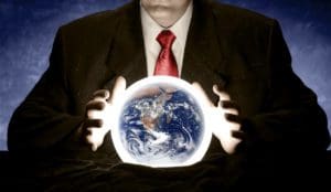 A man is consulting a crystal ball to foretell the future of planet Earth. Earth image courtesy of NASA http://earthobservatory.nasa.gov/