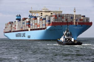 The MV Maersk Mc-Kinney Moller, the world's biggest container ship, arrives at the harbour of Rotterdam August 16, 2013. The 55,000 tonne ship, named after the son of the founder of the oil and shipping group A.P. Moller-Maersk, has a length of 400 meters and cost $185 million. A.P. Moller-Maersk raised its annual profit forecast for the business on Friday, helped by tighter cost controls and lower fuel prices. Maersk shares jumped 6 percent to their highest in 1-1/2 years as investors welcomed a near-doubling of second-quarter earnings at container arm Maersk Line, which generates nearly half of group revenue and is helping counter weakness in the company's oil business. REUTERS/Michael Kooren (NETHERLANDS - Tags: MARITIME TRANSPORT BUSINESS) - RTX12NIU